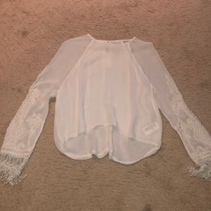 Beige top with lace design on sleeves